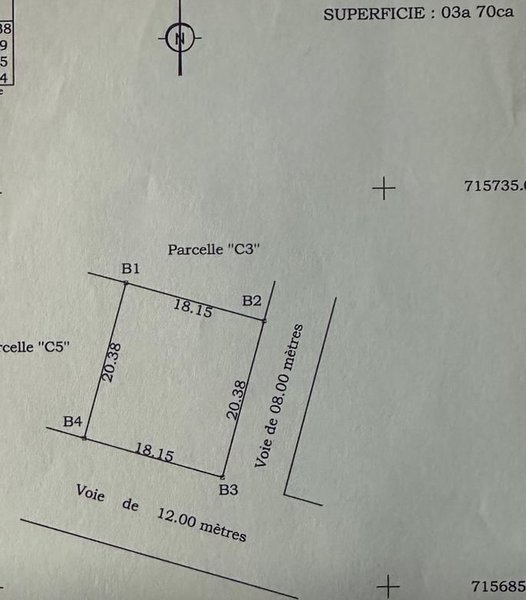 Terrain à vendre avec Titre Foncier Global et voie de 12 mètres en angle de rue